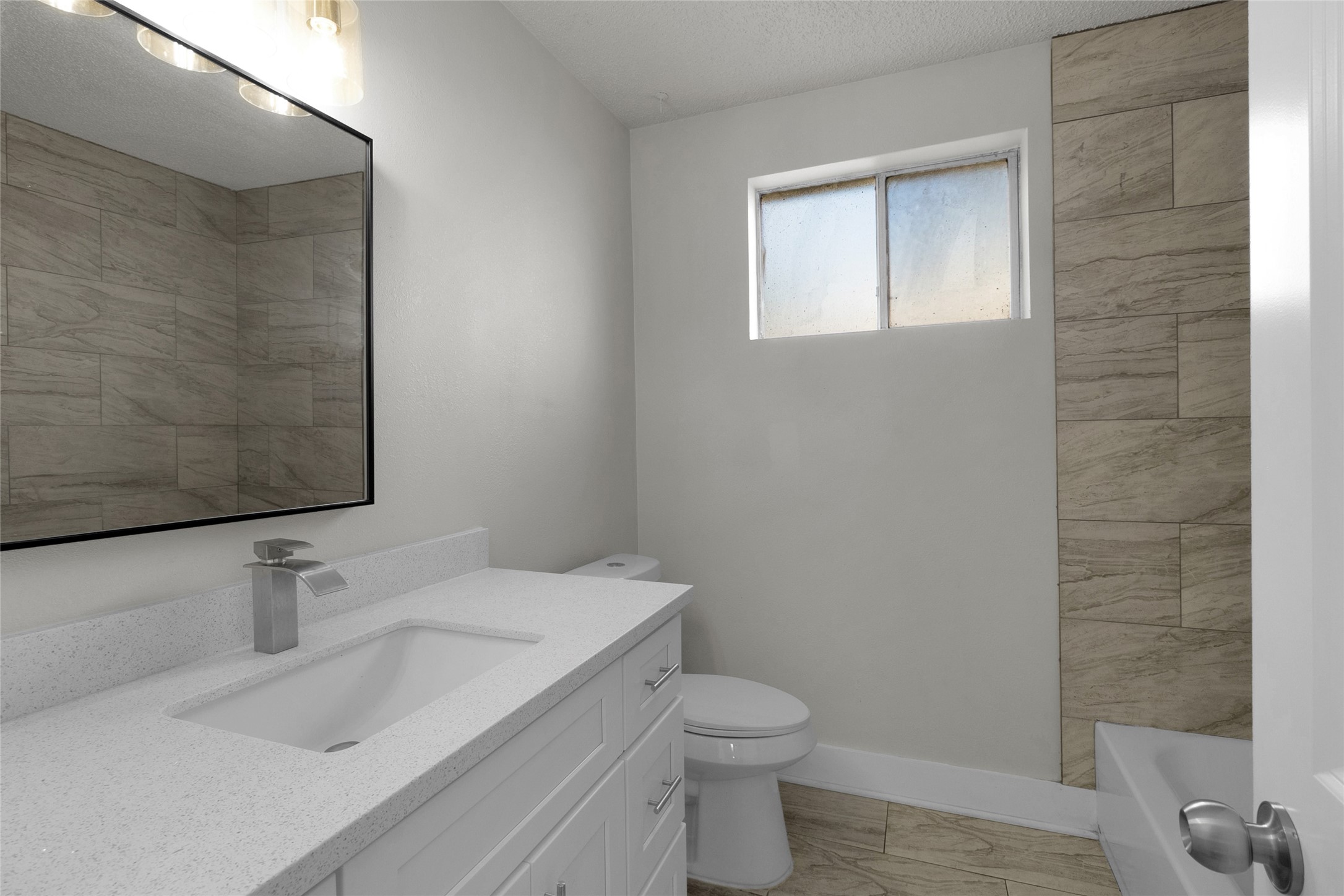 23910 Spring Briar Lane Spring, TX 77373 - Photo 22 of 38 a bathroom with a sink and a toilet