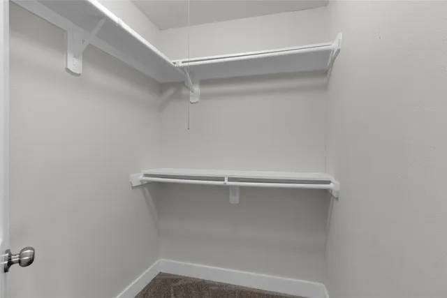 a view of a room with racks on the wall