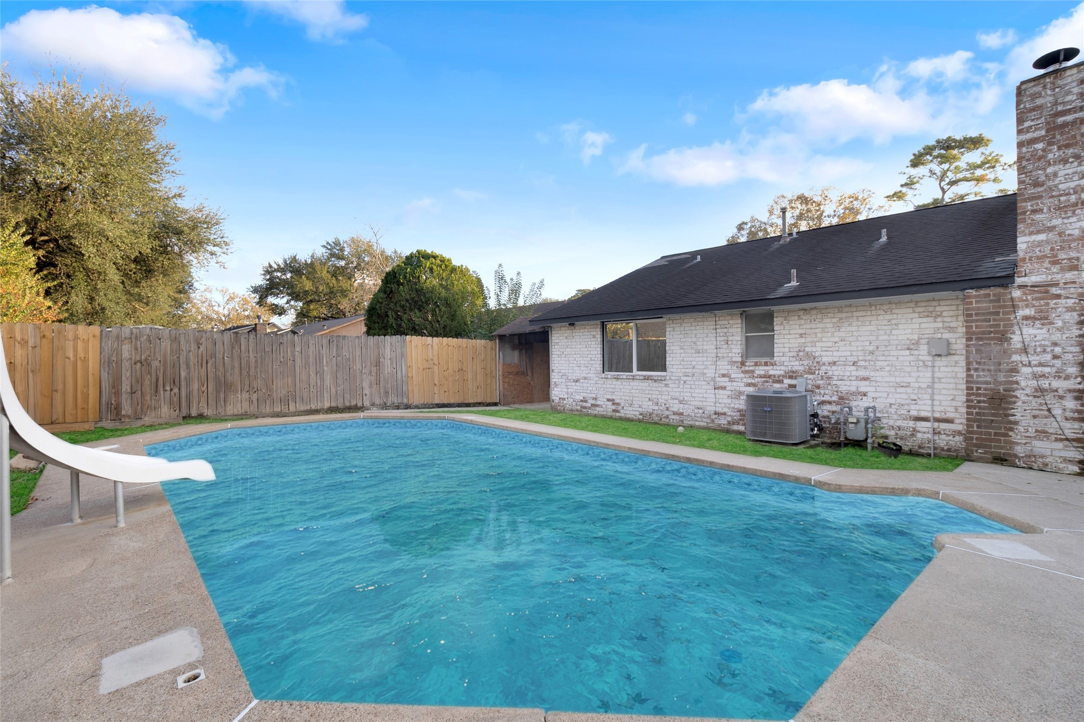 23910 Spring Briar Lane Spring, TX 77373 - Photo 36 of 38 a backyard of a house with table and chairs