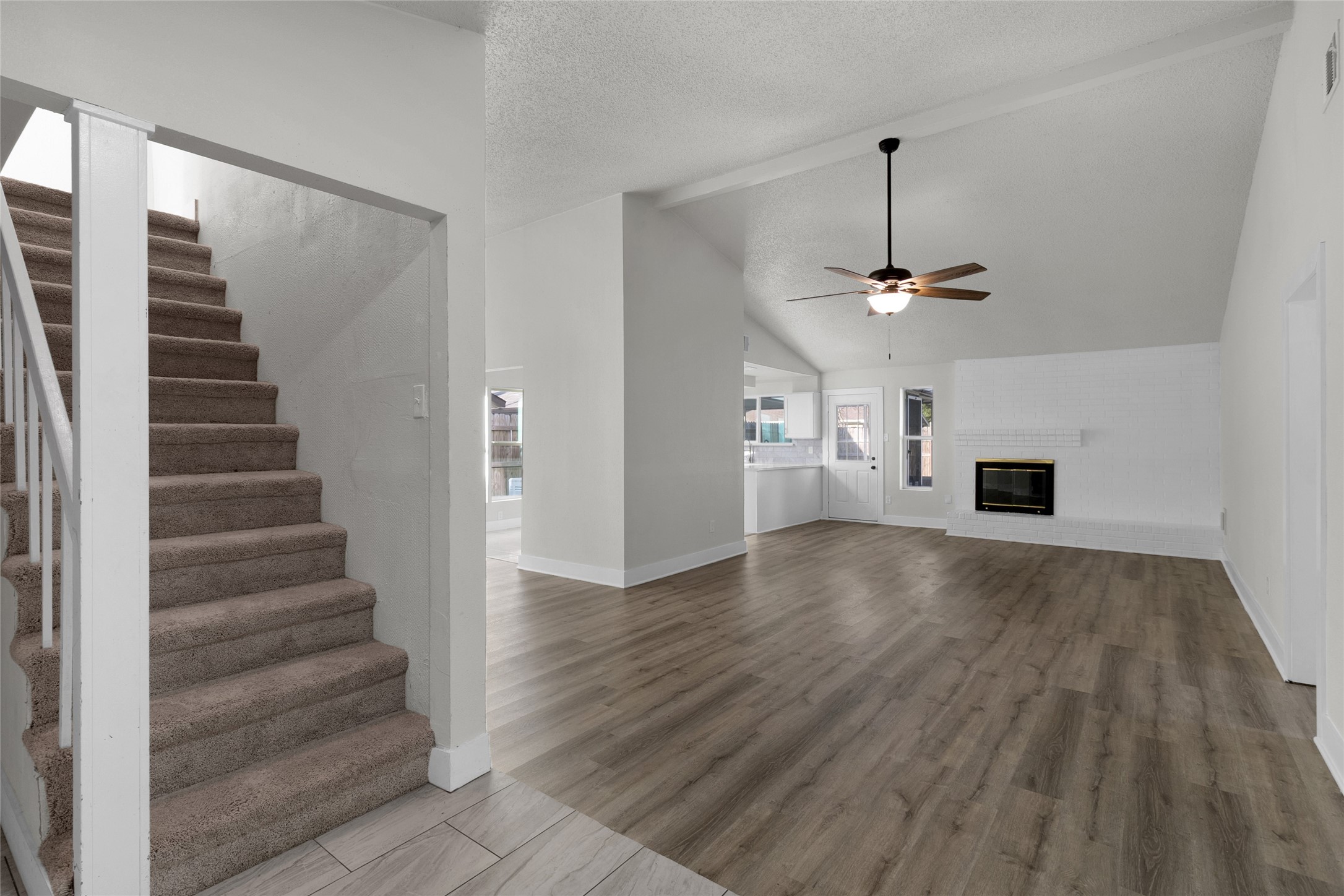 23910 Spring Briar Lane Spring, TX 77373 - Photo 4 of 38 a view of a livingroom with wooden floor and a ceiling fan