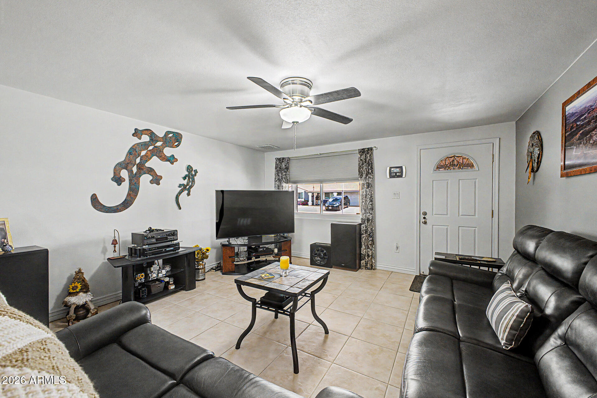 14002 North 37th Place Phoenix, AZ 85032 - Photo 11 of 33 a view of a livingroom with workspace and a couch