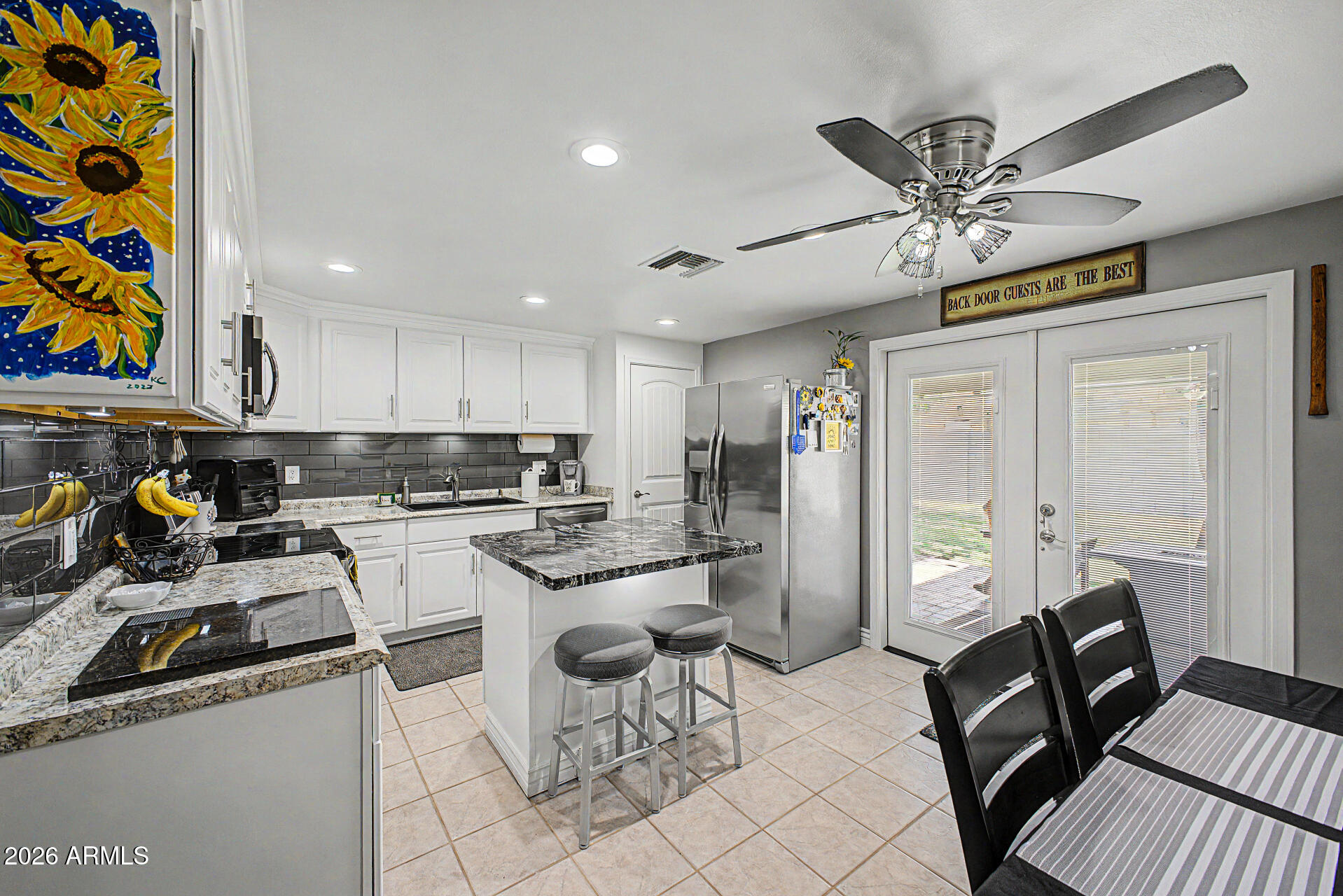 14002 North 37th Place Phoenix, AZ 85032 - Photo 12 of 33 a kitchen with a sink appliances and cabinets
