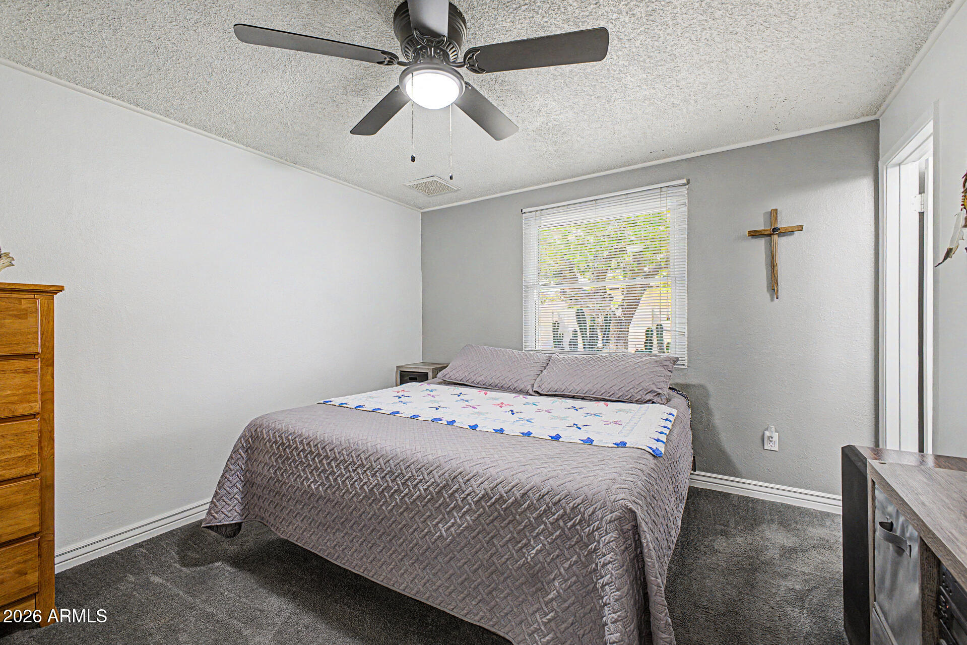 14002 North 37th Place Phoenix, AZ 85032 - Photo 16 of 33 a bedroom with a bed and a window