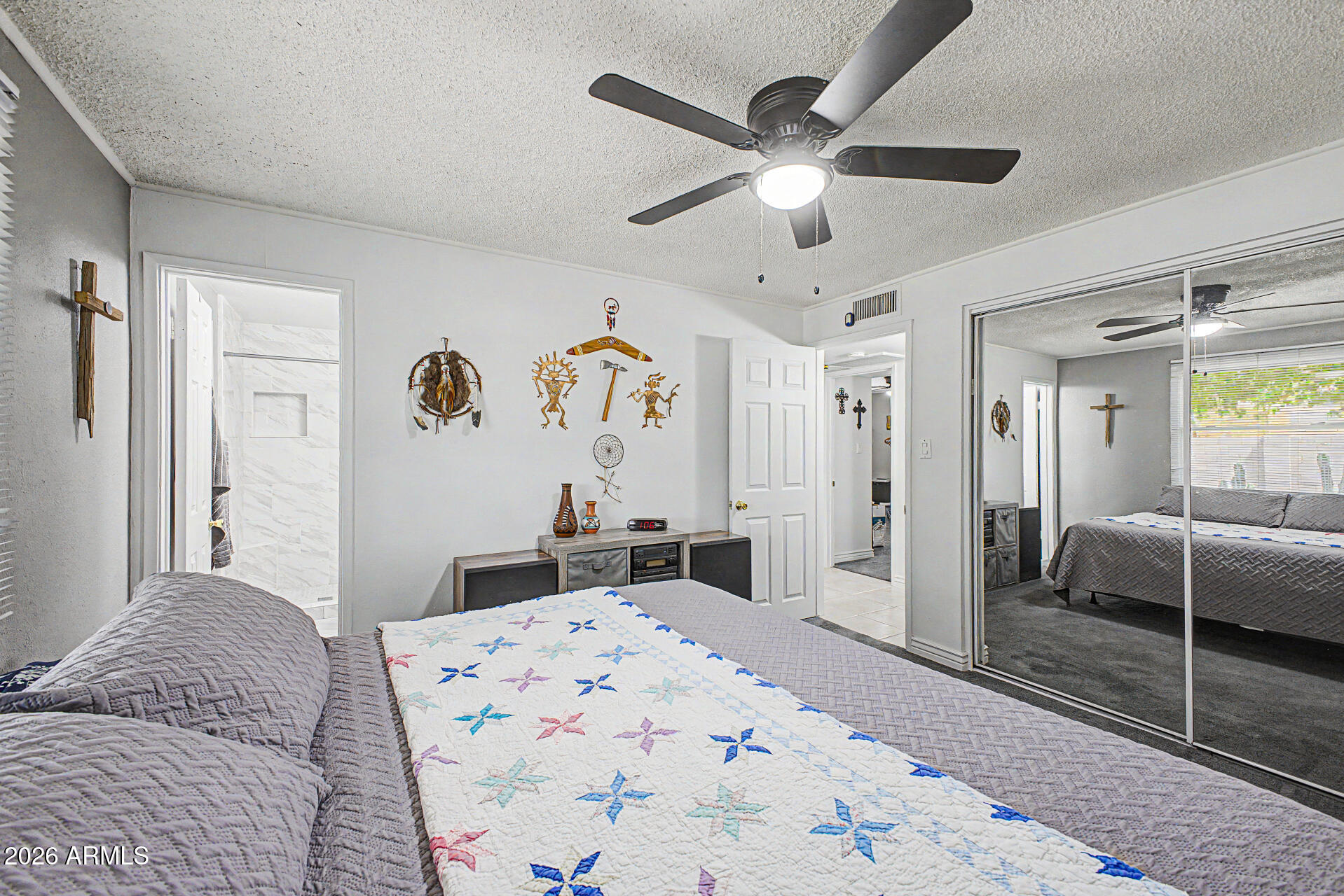 14002 North 37th Place Phoenix, AZ 85032 - Photo 18 of 33 a bedroom with a bed and a large mirror