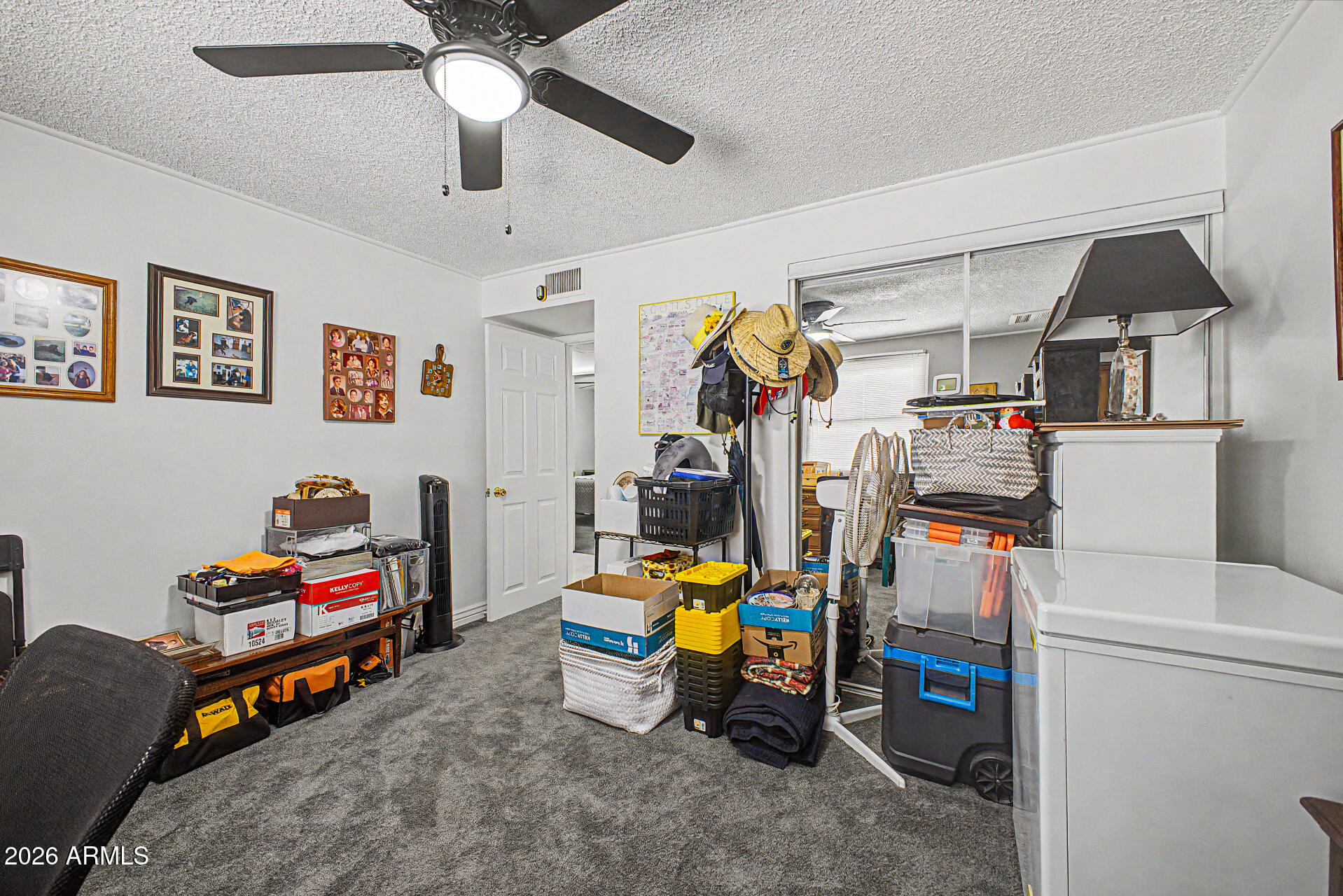 14002 North 37th Place Phoenix, AZ 85032 - Photo 21 of 33 a room with furniture a ceiling fan and a window