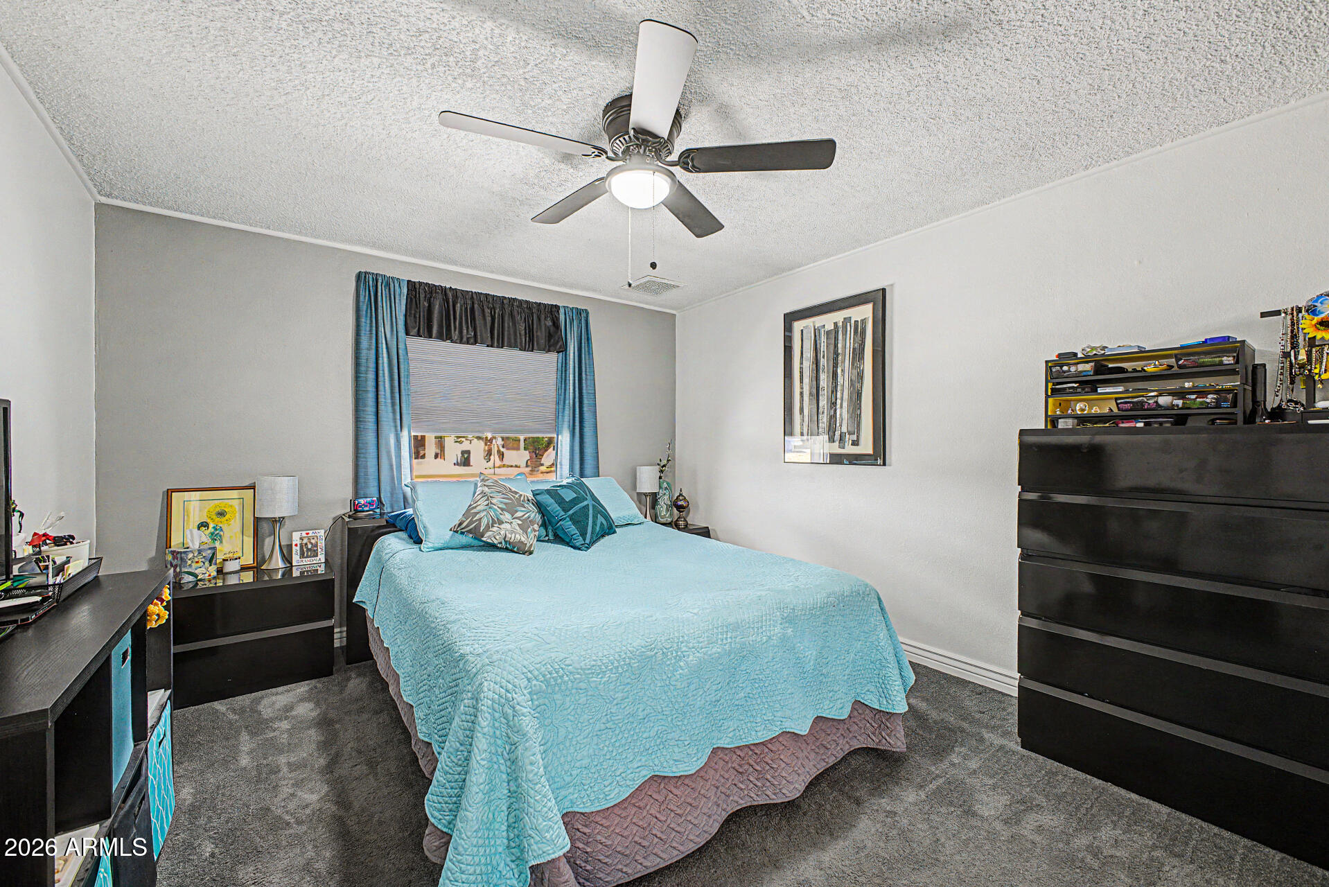 14002 North 37th Place Phoenix, AZ 85032 - Photo 22 of 33 a bedroom with a bed and wooden floor