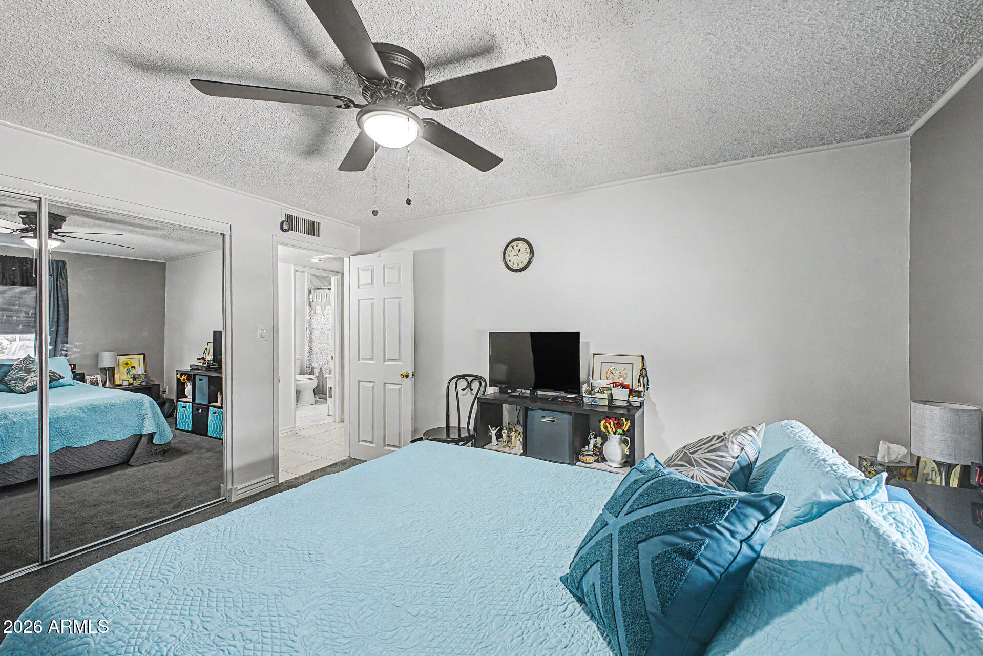 14002 North 37th Place Phoenix, AZ 85032 - Photo 23 of 33 a bedroom with a bed and a flat tv screen