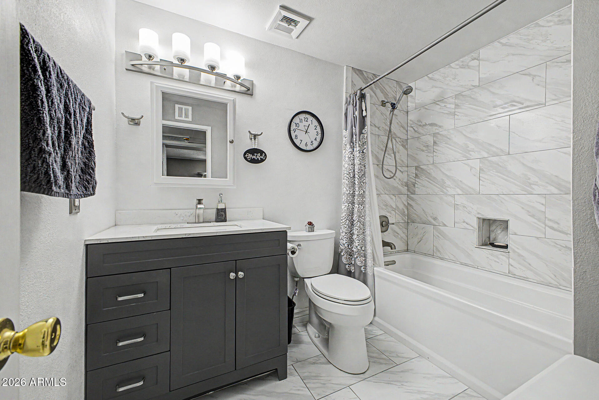 14002 North 37th Place Phoenix, AZ 85032 - Photo 24 of 33 a bathroom with a sink a toilet and shower