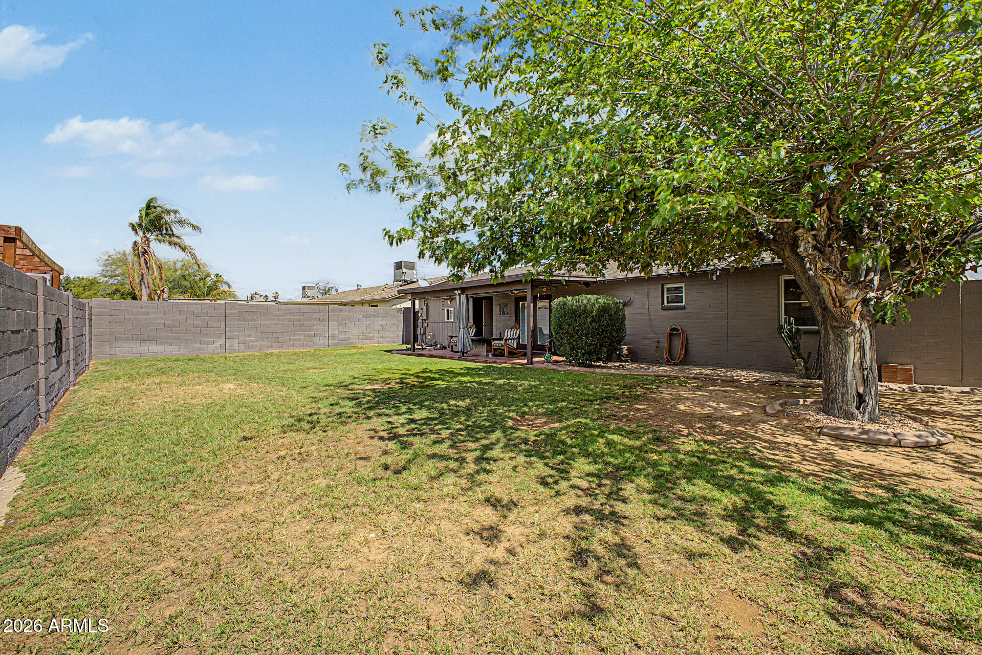 14002 North 37th Place Phoenix, AZ 85032 - Photo 30 of 33 a backyard of a house with lots of green space