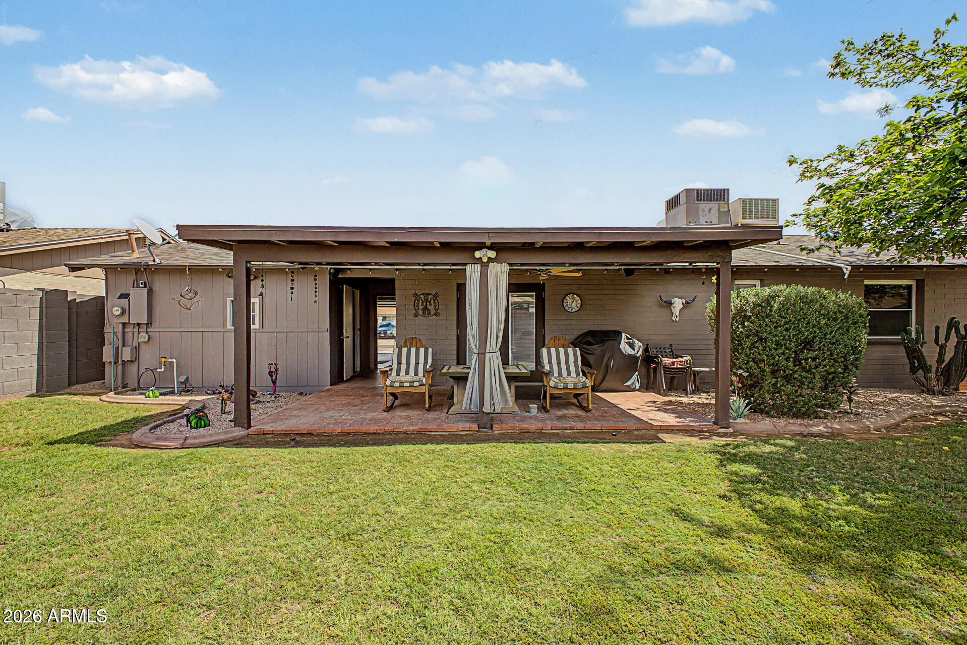 14002 North 37th Place Phoenix, AZ 85032 - Photo 31 of 33 a view of a house with backyard and sitting area