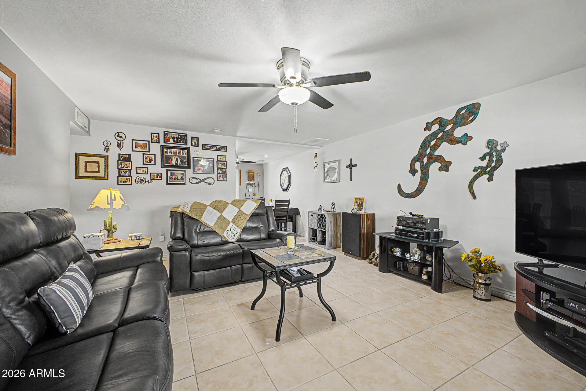 14002 North 37th Place Phoenix, AZ 85032 - Photo 8 of 33 a living room with furniture and a flat screen tv