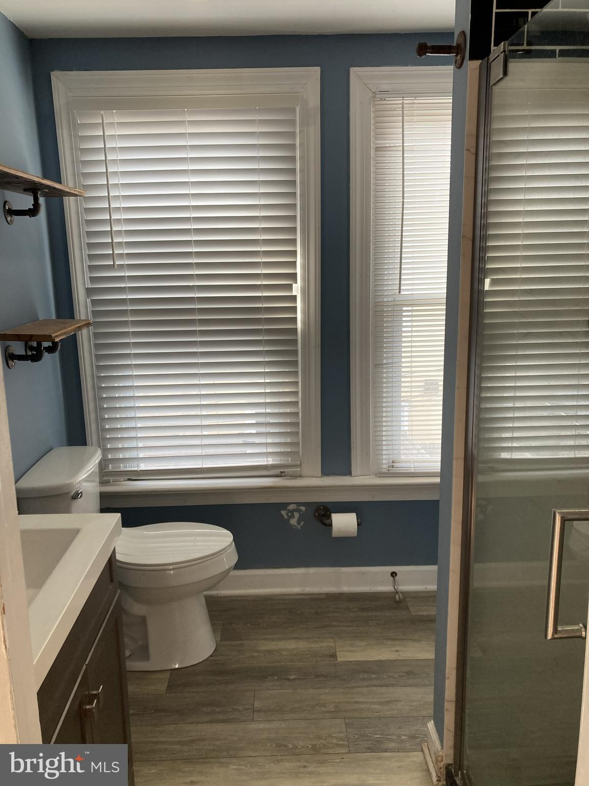 1304 Marlborough Street Philadelphia, PA 19125 - Photo 14 of 19 a bathroom with a toilet a sink and a window