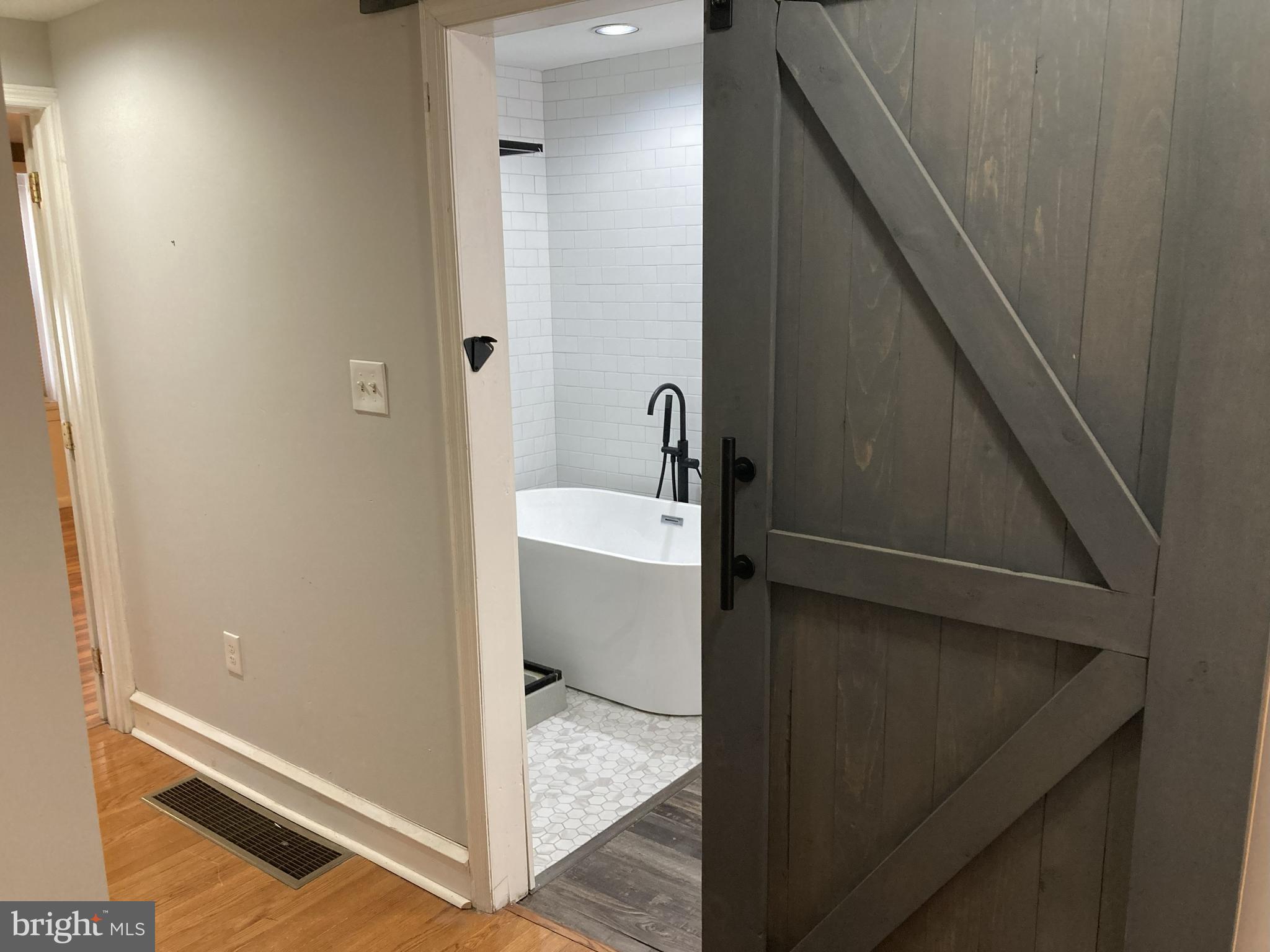 1304 Marlborough Street Philadelphia, PA 19125 - Photo 16 of 19 a bathroom with a sink and mirror
