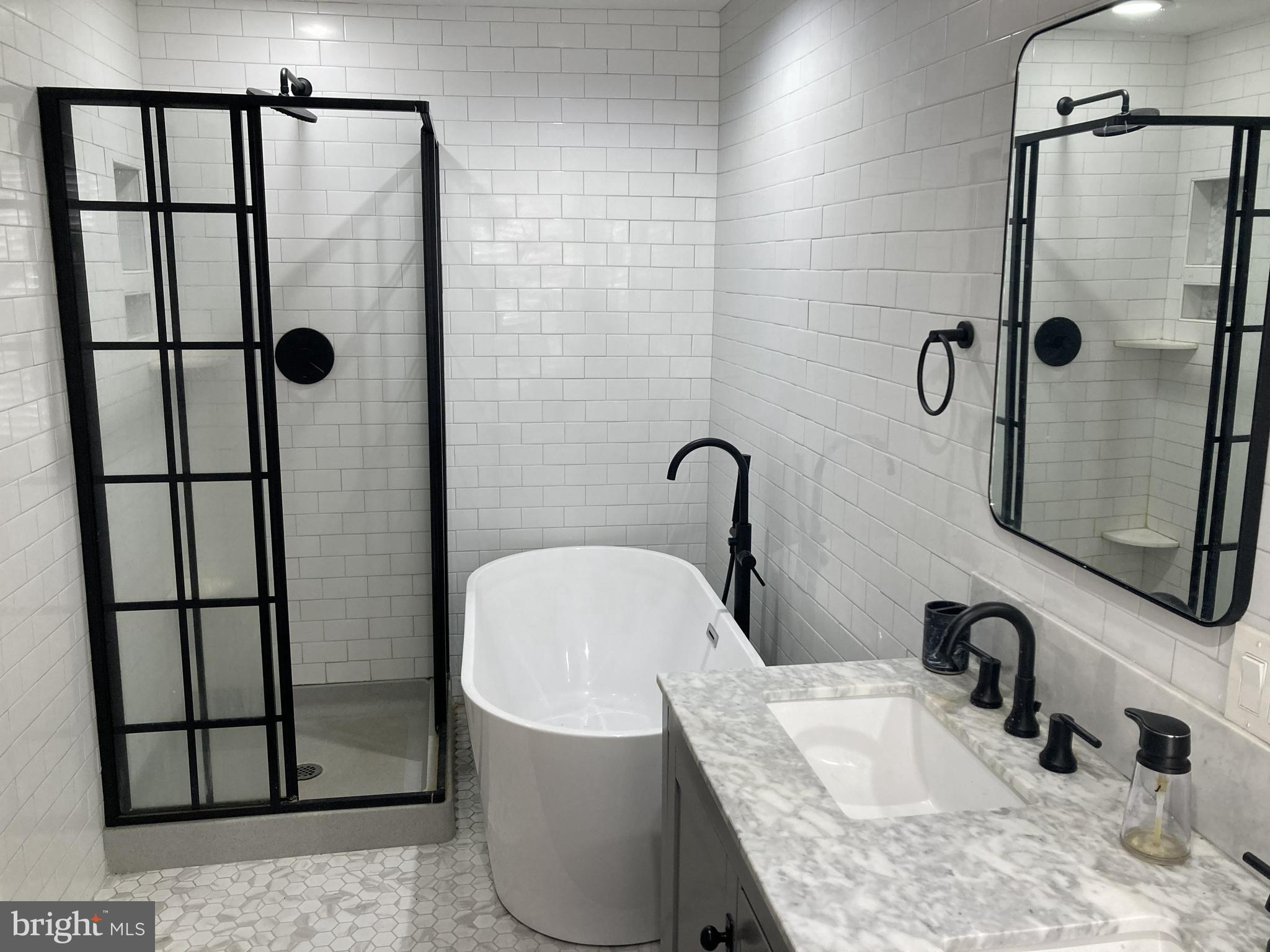1304 Marlborough Street Philadelphia, PA 19125 - Photo 18 of 19 a bathroom with a granite countertop sink mirror and shower