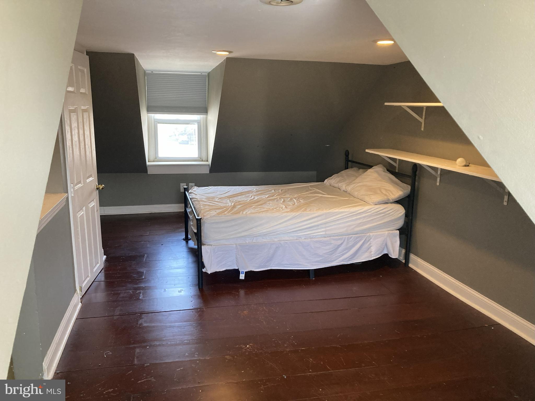 1304 Marlborough Street Philadelphia, PA 19125 - Photo 19 of 19 a bedroom with a bed and wooden floor
