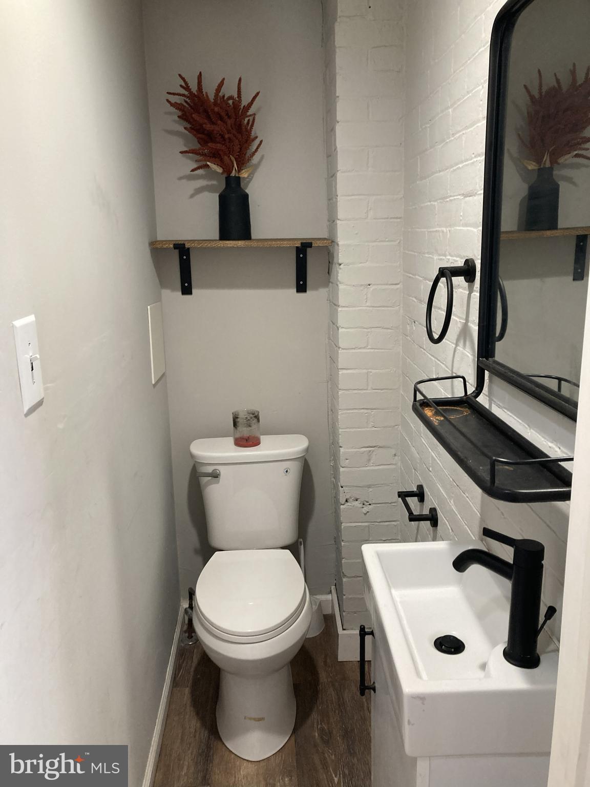 1304 Marlborough Street Philadelphia, PA 19125 - Photo 7 of 19 a bathroom with a toilet sink and mirror