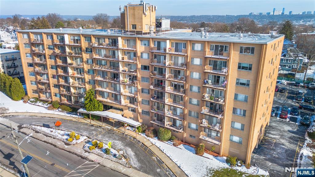 265 Main Street, Unit 503 Ridgefield Park, NJ 07660 - Photo 1 of 23 a view of a building with a lot of windows