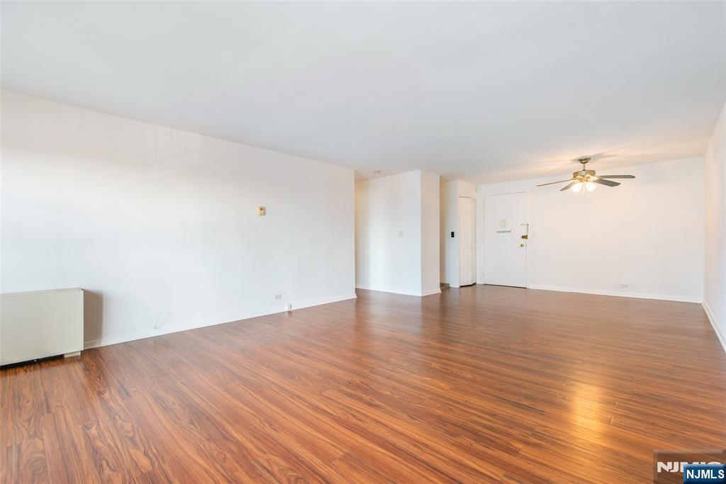 265 Main Street, Unit 503 Ridgefield Park, NJ 07660 - Photo 10 of 23 a view of empty room with wooden floor and fan
