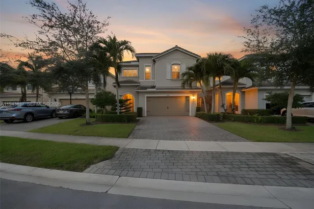 a view of a house with backyard and porch