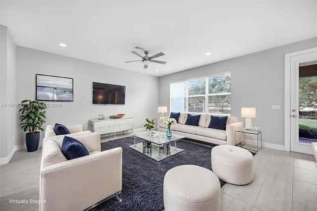 a bedroom with bed and a potted plant