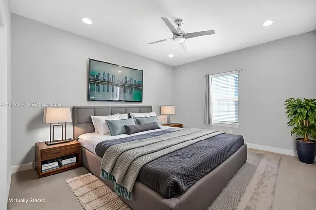 a kitchen with cabinets stainless steel appliances and a window