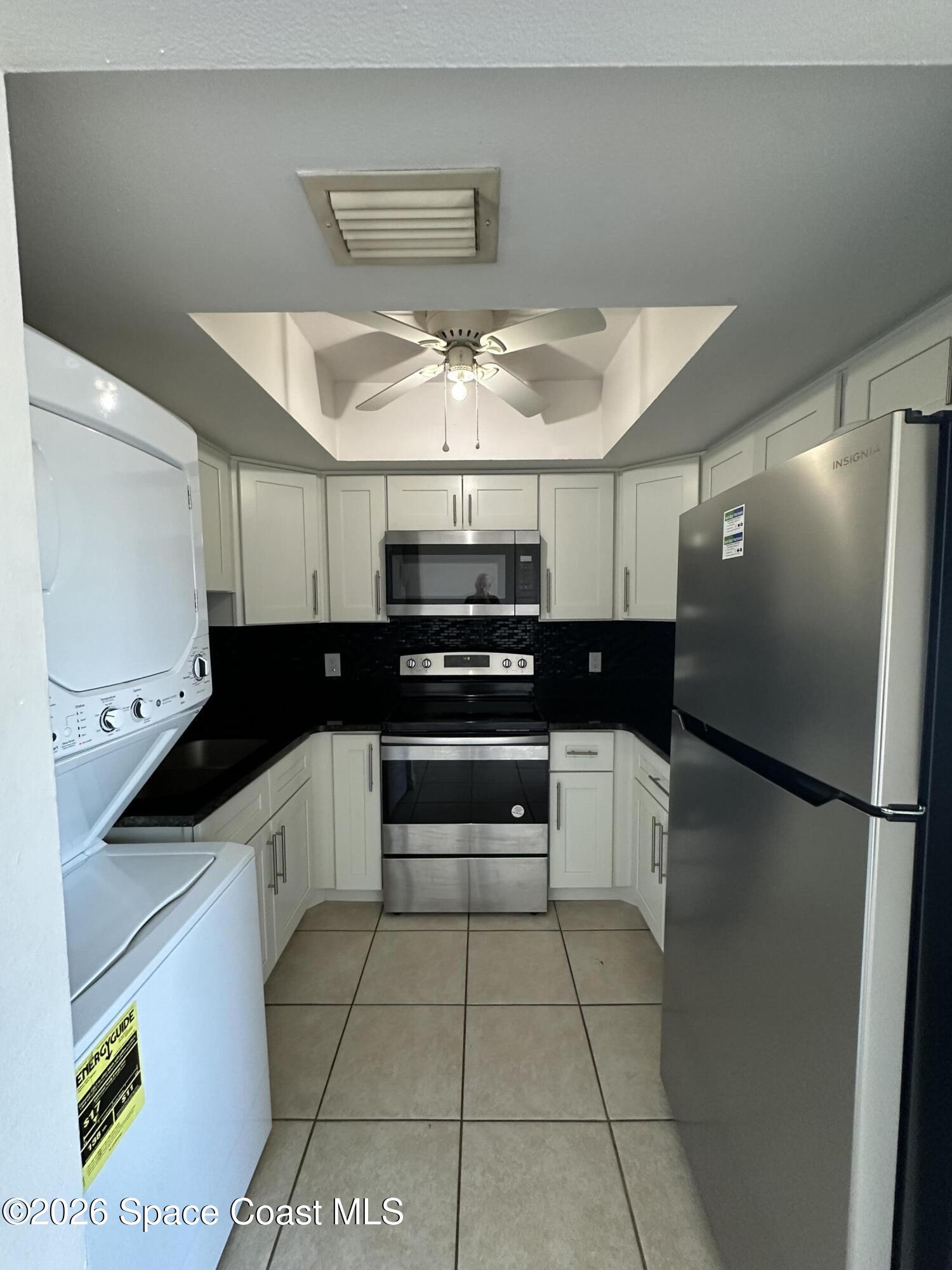 837 Hickory Street, Unit 3 Melbourne, FL 32901 - Photo 11 of 24 a kitchen with a sink and cabinets
