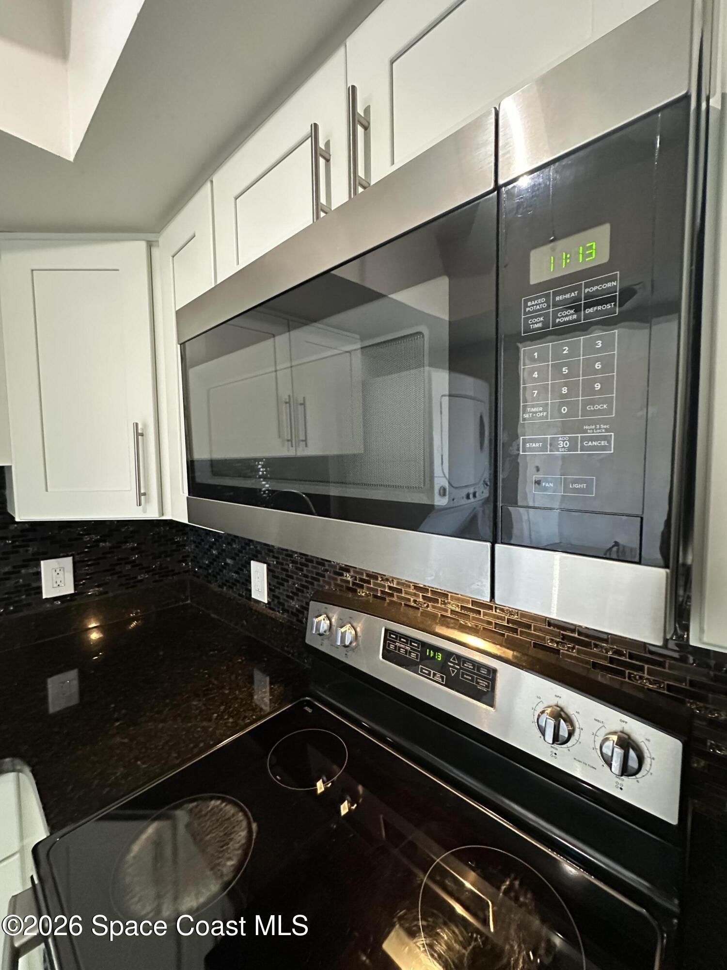 837 Hickory Street, Unit 3 Melbourne, FL 32901 - Photo 13 of 24 a close view of stove