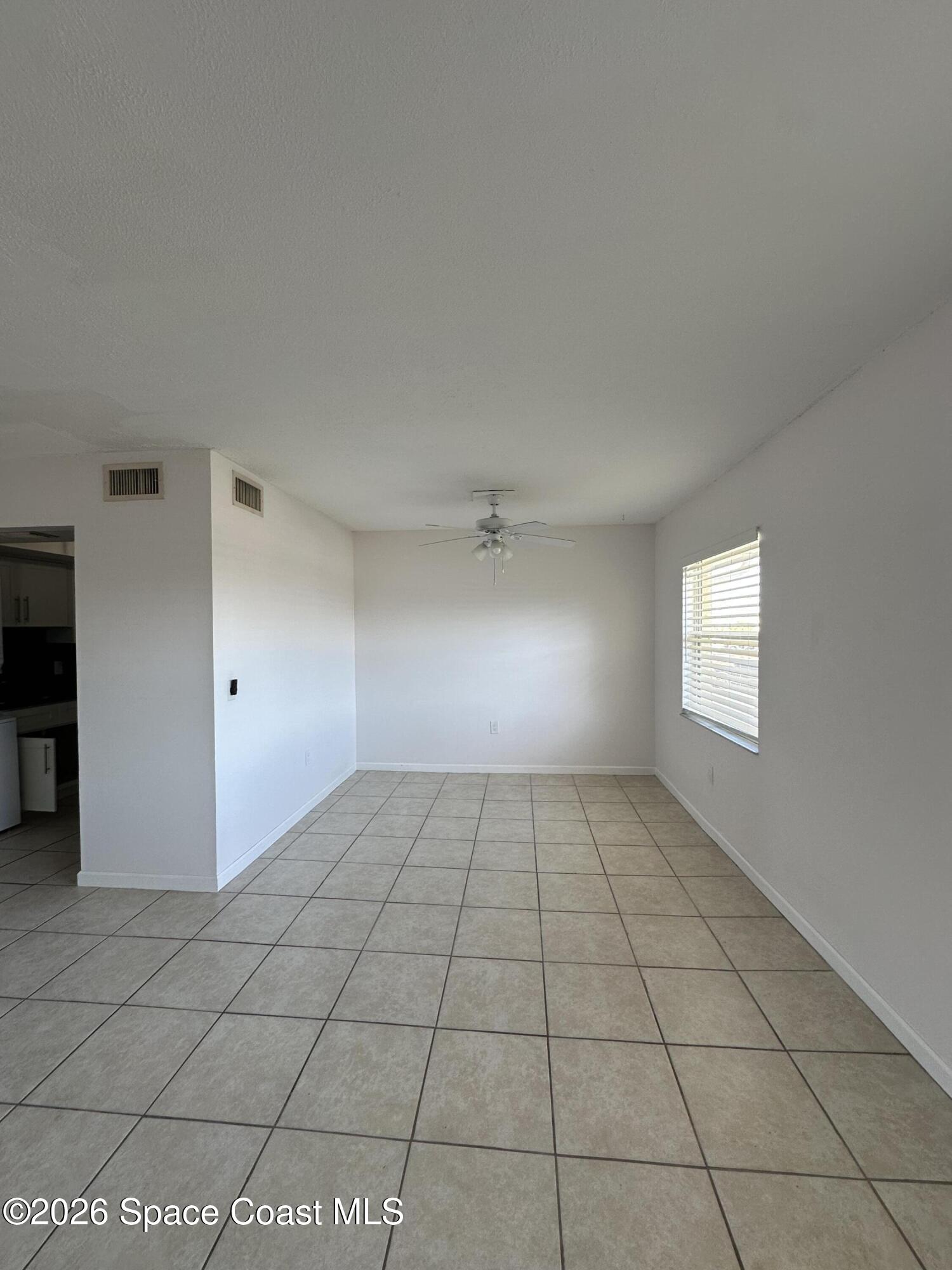 837 Hickory Street, Unit 3 Melbourne, FL 32901 - Photo 17 of 24 a view of an empty room and window