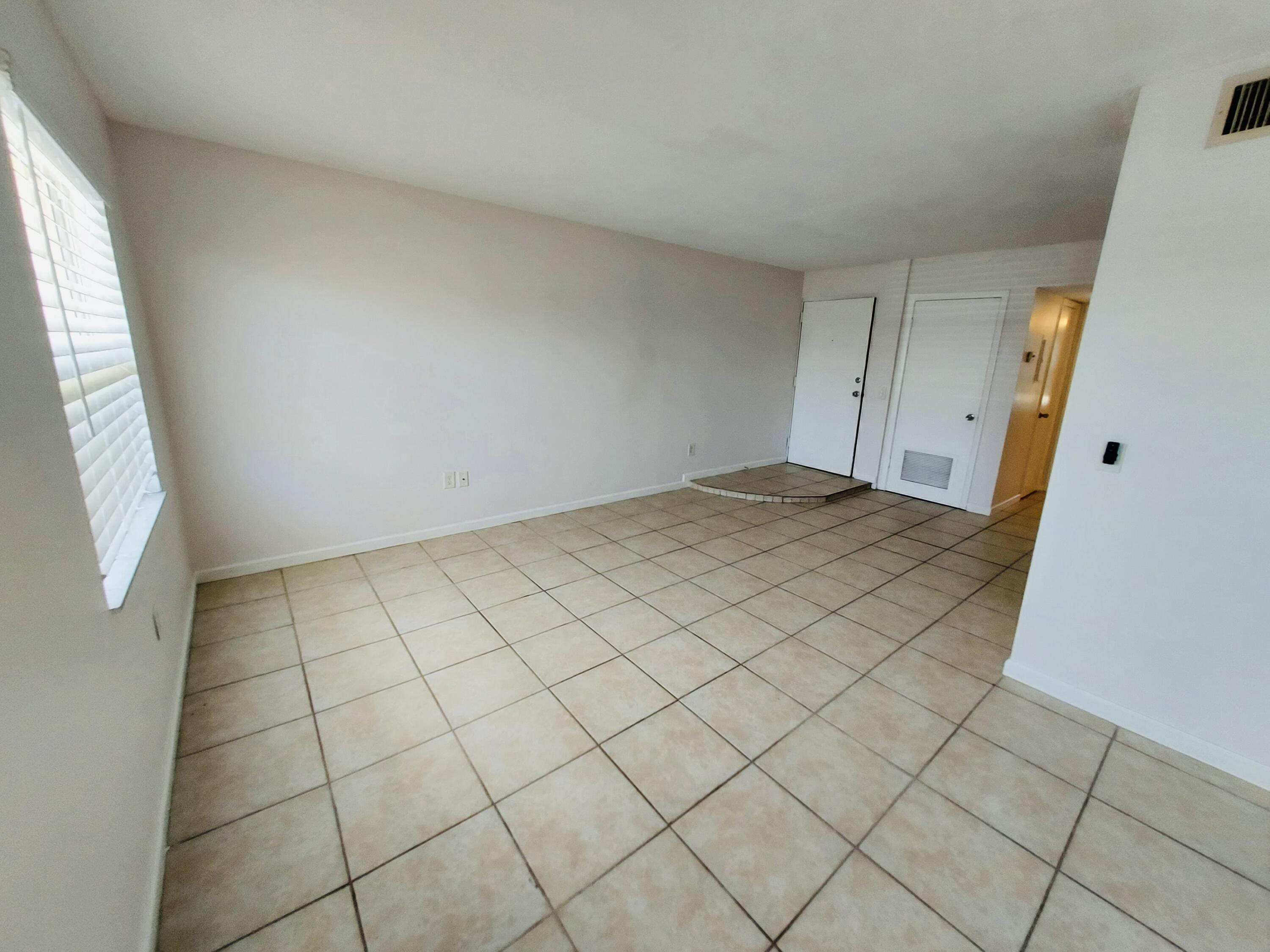 837 Hickory Street, Unit 3 Melbourne, FL 32901 - Photo 18 of 24 a view of an empty room and a window
