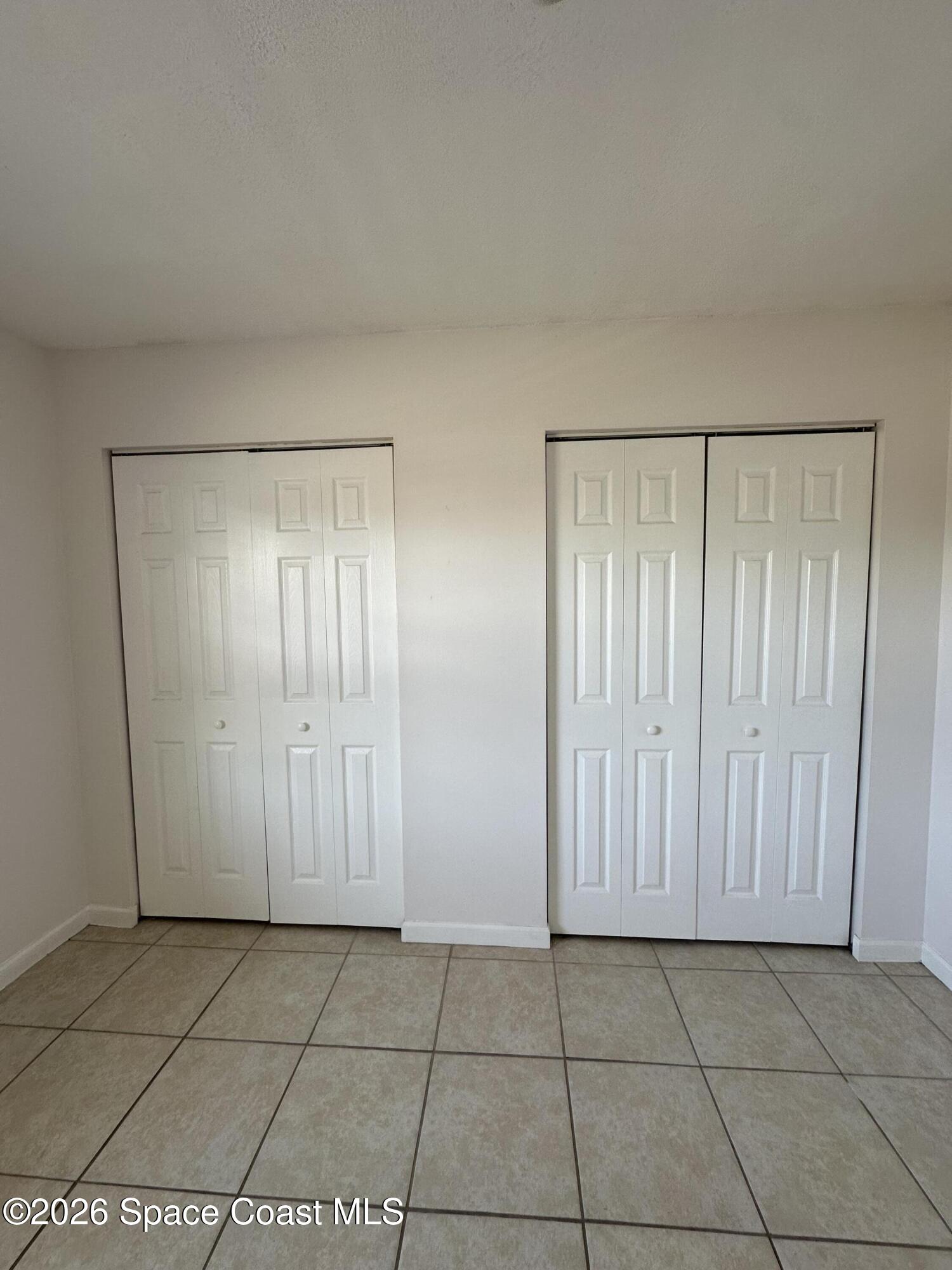 837 Hickory Street, Unit 3 Melbourne, FL 32901 - Photo 20 of 24 an empty room with a door