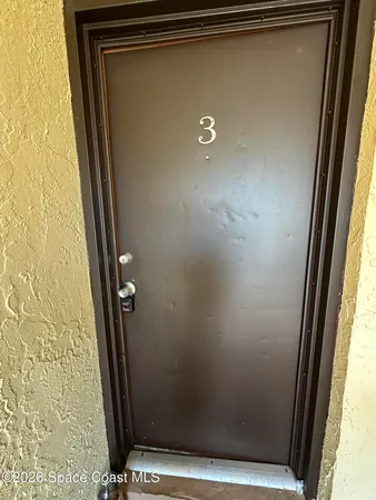 a view of a car park in front of a house