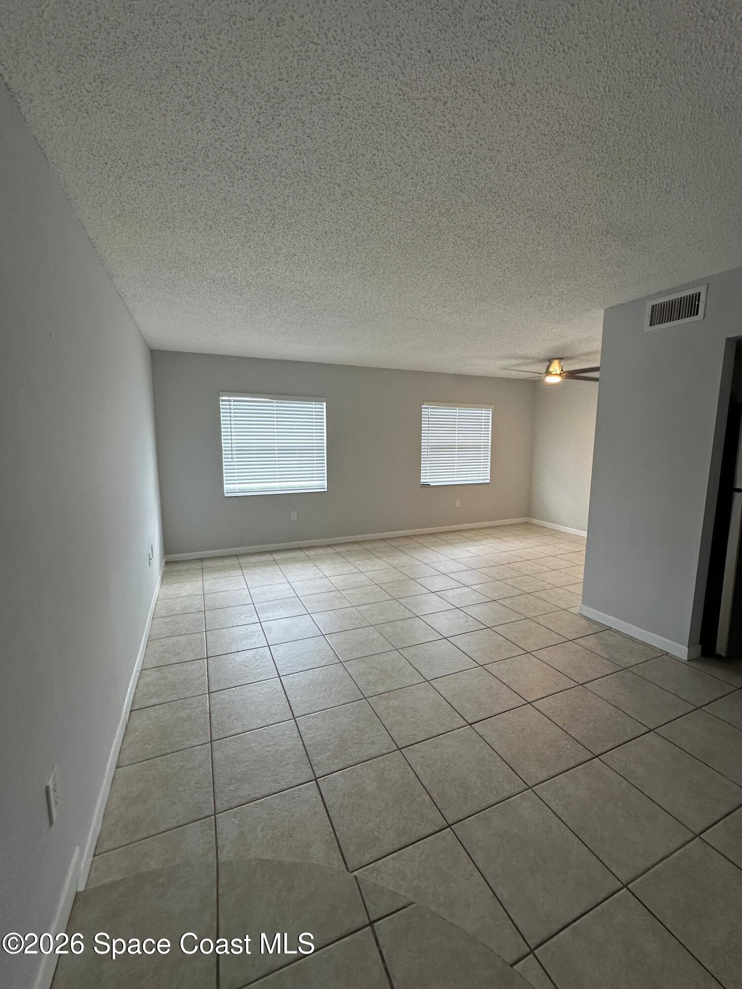 837 Hickory Street, Unit 3 Melbourne, FL 32901 - Photo 8 of 24 a view of an empty room and window