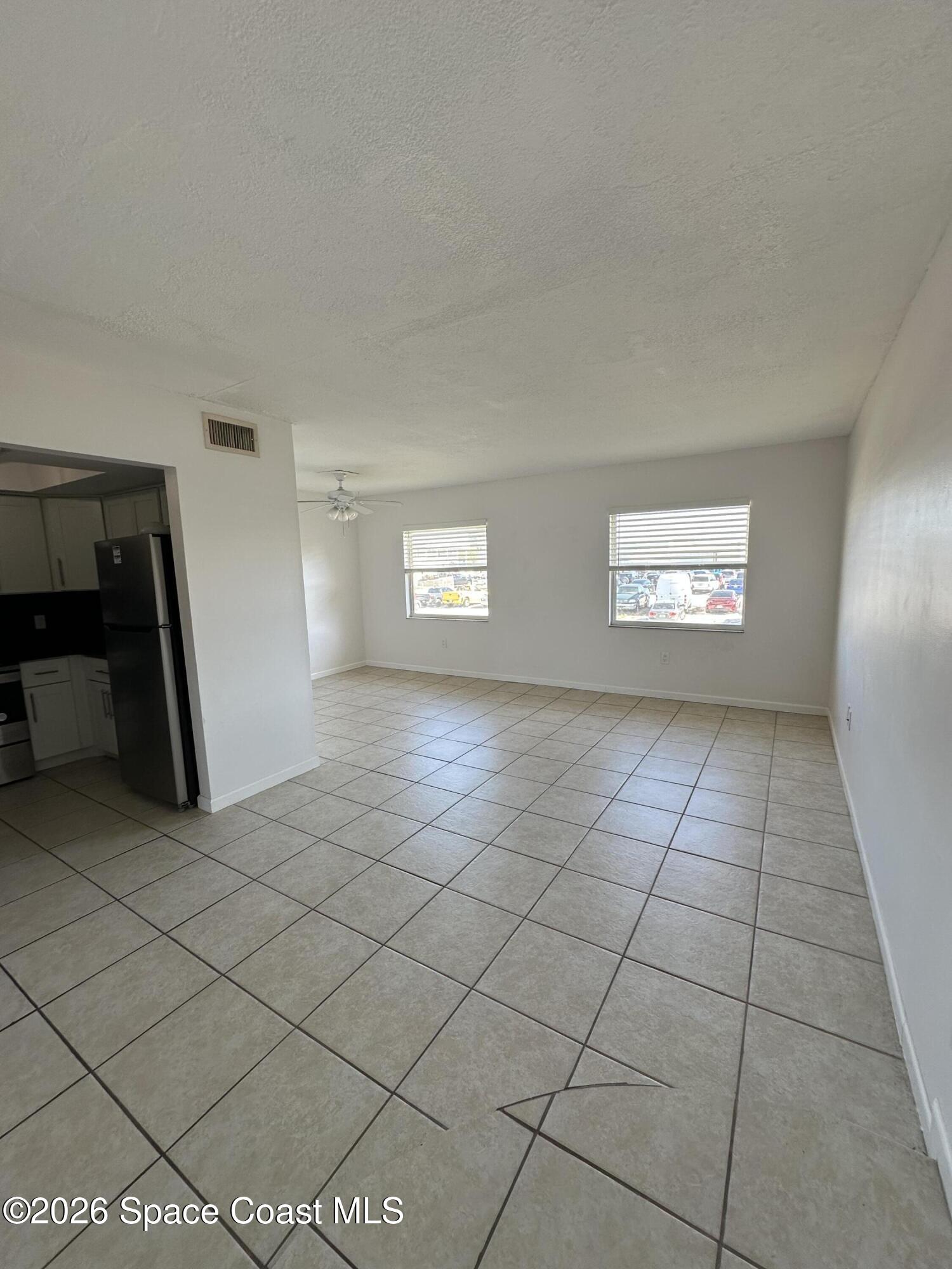 837 Hickory Street, Unit 3 Melbourne, FL 32901 - Photo 9 of 24 a view of an empty room and window