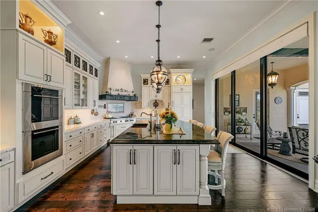 a large bedroom with a large bed and large windows