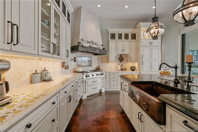 a large bathroom with a sink and a large mirror