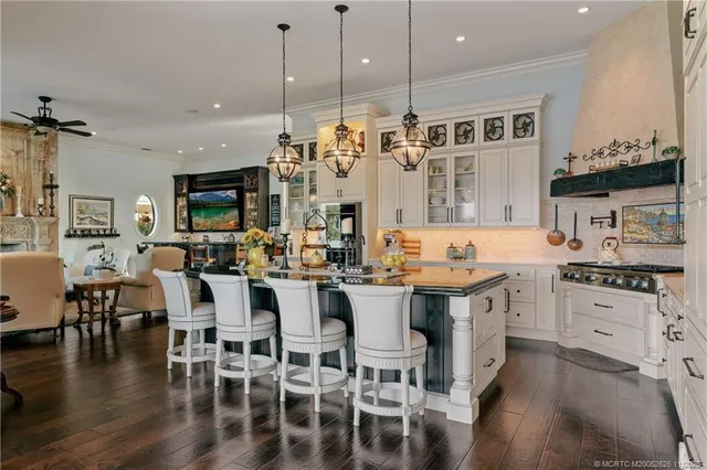 a bedroom with a bed a table and painting on the wall