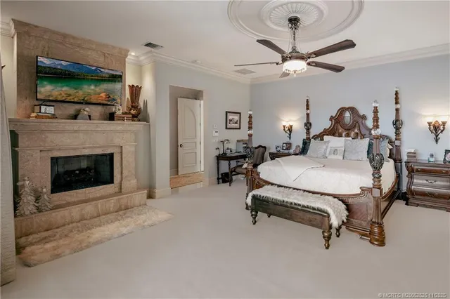 a bedroom with a bed and glass windows