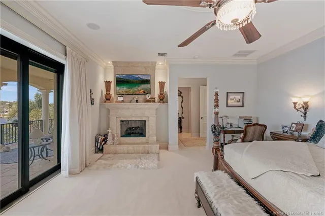 a bedroom with furniture and a chandelier