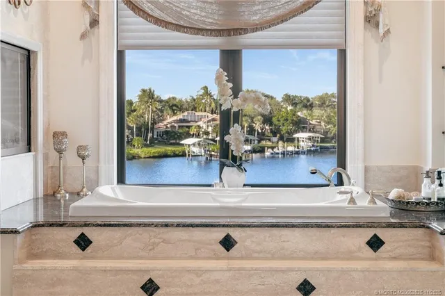 a view of a house with a flower garden