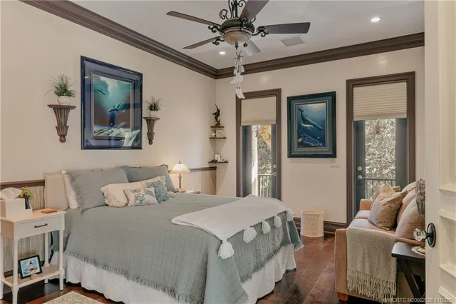 an aerial view of a house with swimming pool and outdoor seating