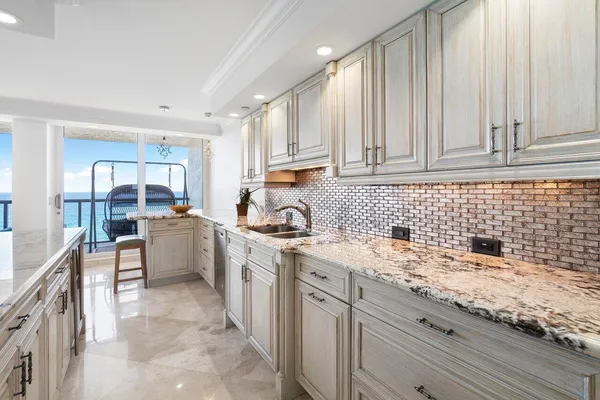 a spacious bedroom with a bed and a couch