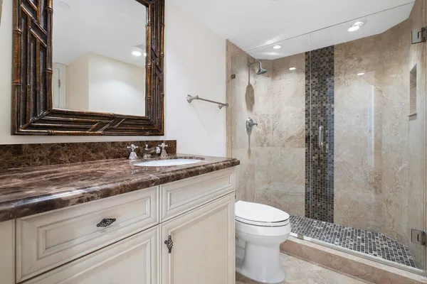 a spacious bedroom with a bed and large window