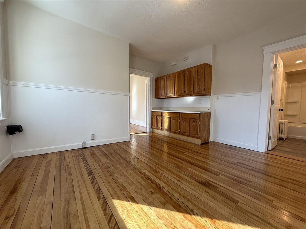 304 Lovell Street, Unit 2 Worcester, MA 01602 - Photo 11 of 13 a view of empty room with wooden floor