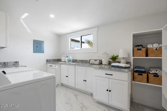 a kitchen with sink cabinets and wooden floor