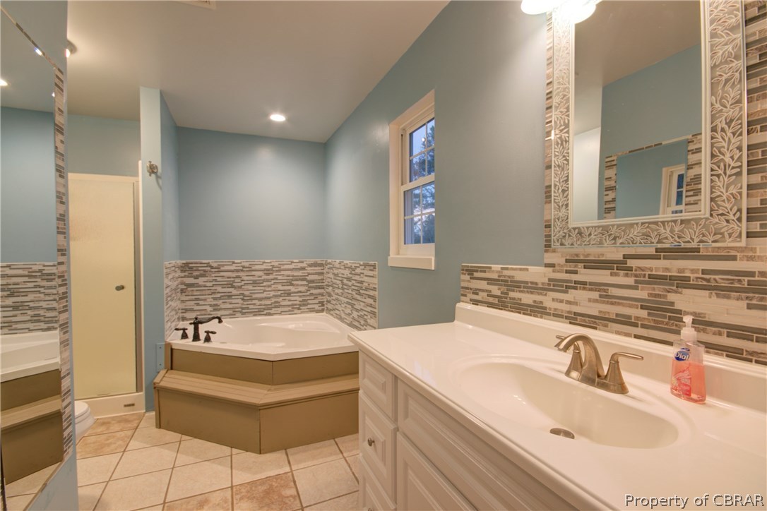 8757 Glass Road Hayes, VA 23072 - Photo 17 of 34 Calming colors and jetted tub. Just add candles of your choice.