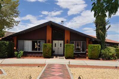 20354 Tonawanda Road Apple Valley, CA 92307 - Photo 1 of 1 a front view of a house with garden