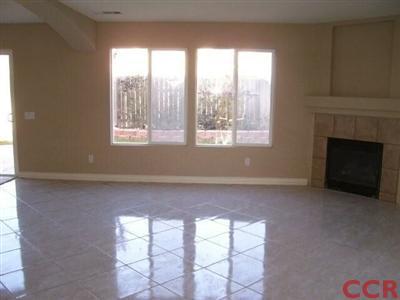 2255 Signal Avenue Santa Maria, CA 93458 - Photo 2 of 9 an empty room with windows and fireplace