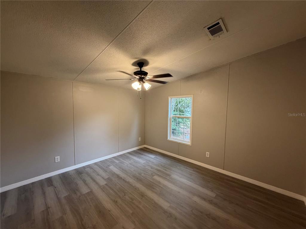 212 Paradise Shores Road Crescent City, FL 32112 - Photo 16 of 23 a view of an empty room with a window