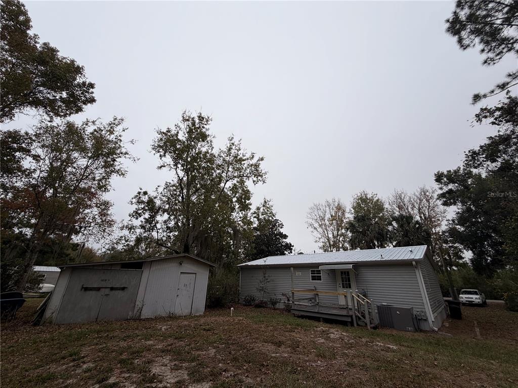 212 Paradise Shores Road Crescent City, FL 32112 - Photo 2 of 23 a view of a barn with green space