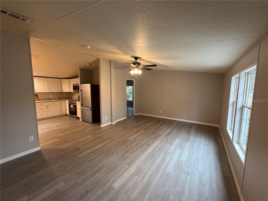 212 Paradise Shores Road Crescent City, FL 32112 - Photo 6 of 23 a view of a kitchen with a sink and refrigerator